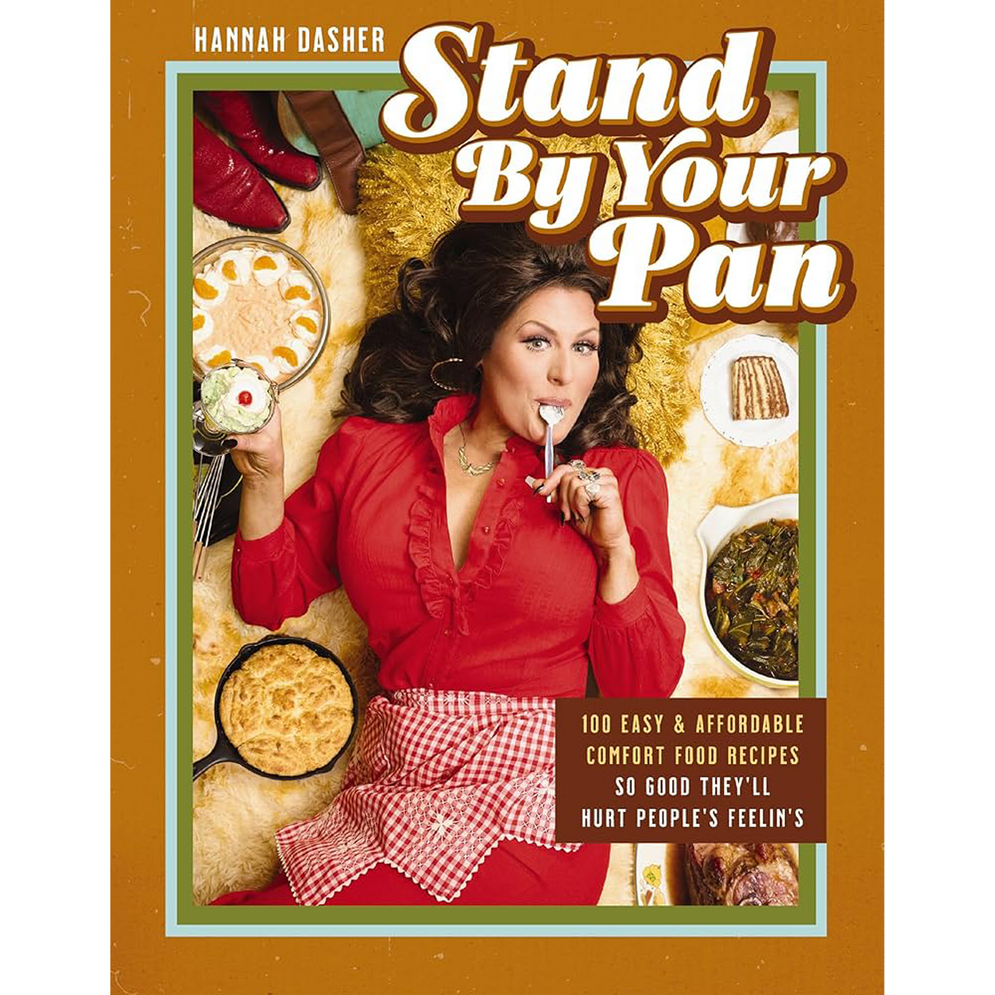 Book cover of 'Stand By Your Pan' with a woman in a red dress surrounded by food items.