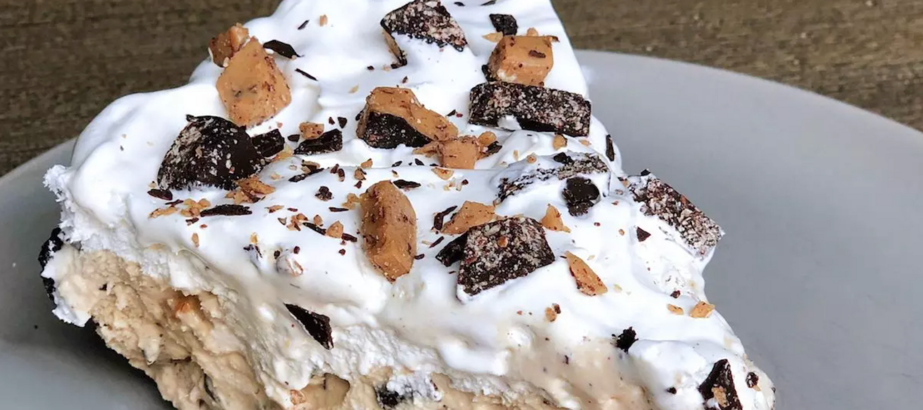Griff's Toffee Ice cream pie topped with whipped cream, toffee, and chocolate pieces 