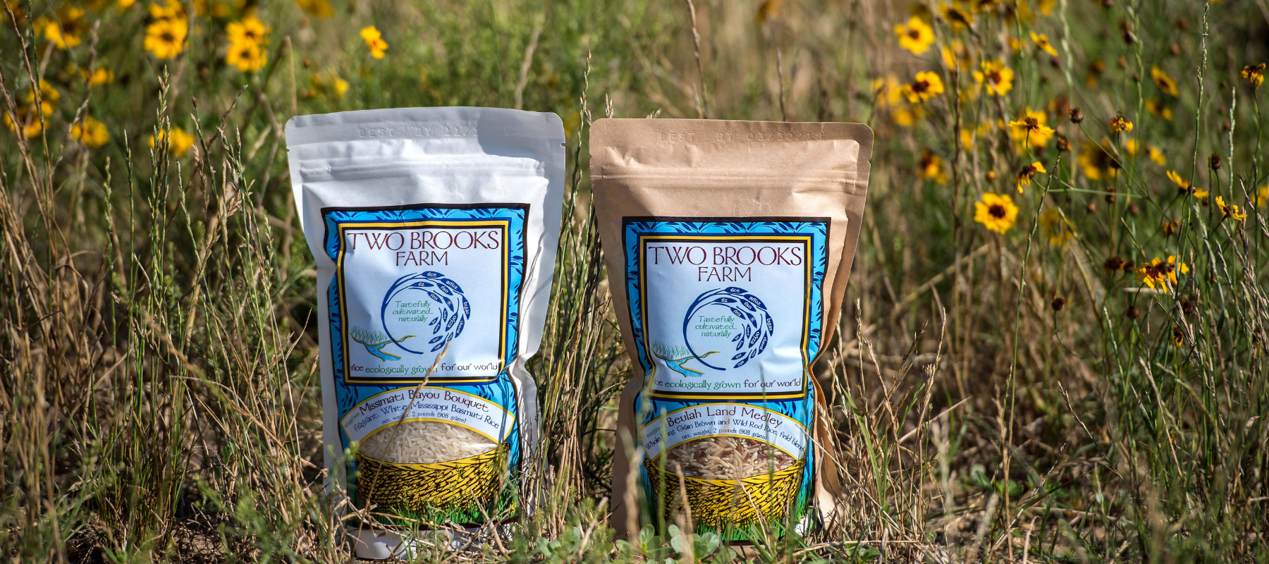 two bags of Two Brooks Farms Rice in a field 