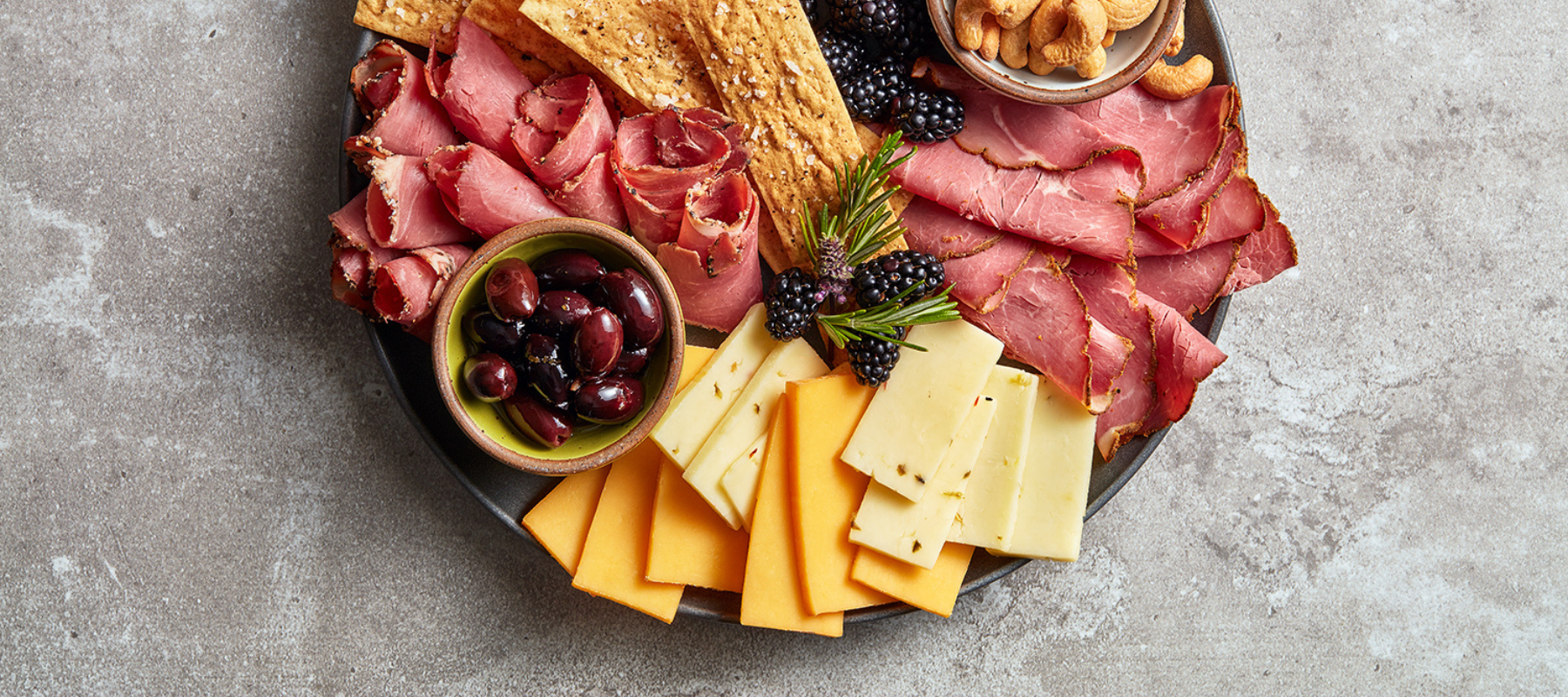 A charcuterie board with lamb from Aussies Selects, pair with Billie's Pecans