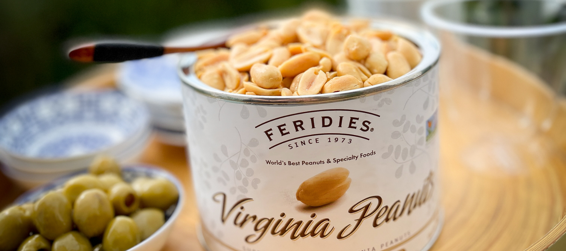 FEREDIES featured image, a can of peanuts next to a bowl of olives