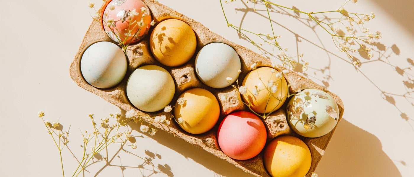 Multcolored Easter eggs in a carton