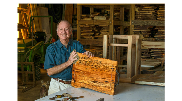 Founder Murry Thompson with a hand-made cutting board