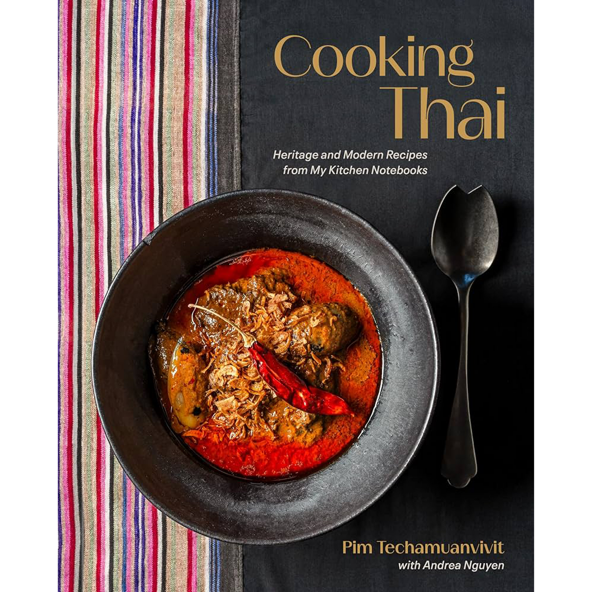 Book cover for 'Cooking Thai' by Pim Techamunivit with Andree Nguyen, featuring a bowl of red Thai curry with a dried red chili and a spoon on a dark background next to a striped textile.