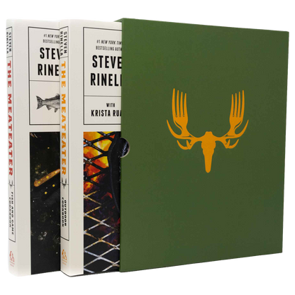 Book set for The Meater by Steve Rine, showing the white hardcover edition with illustrated cover art, a matching green slipcase with a yellow antler graphic, and the spine of another white book standing behind.
