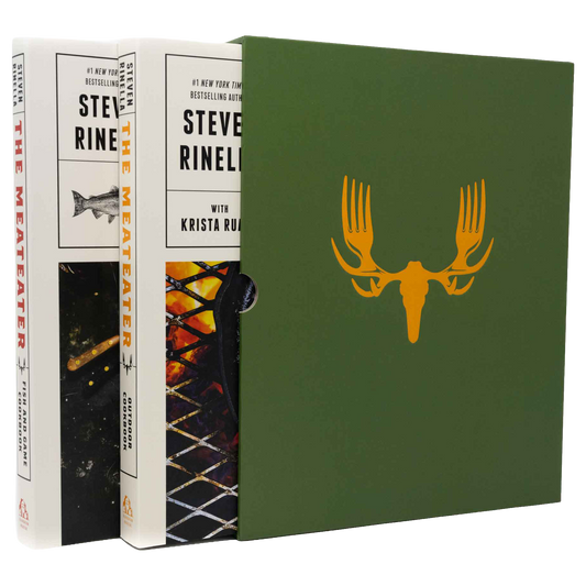 Book set for The Meater by Steve Rine, showing the white hardcover edition with illustrated cover art, a matching green slipcase with a yellow antler graphic, and the spine of another white book standing behind.