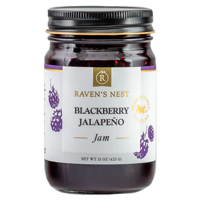 A jar of "Raven's Nest Blackberry Jalapeño Jam" with a white label and featuring the brand logo 