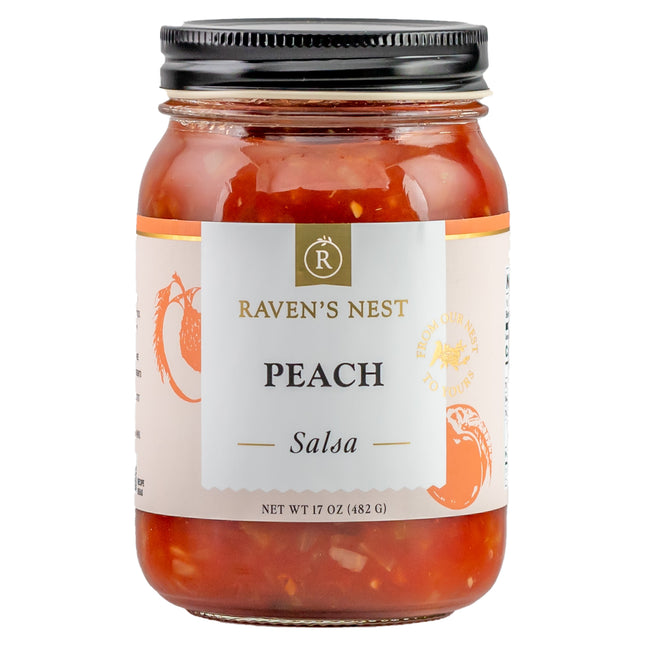 A jar of "Raven's Nest Peach Salsa" with a white label featuring the brand logo 